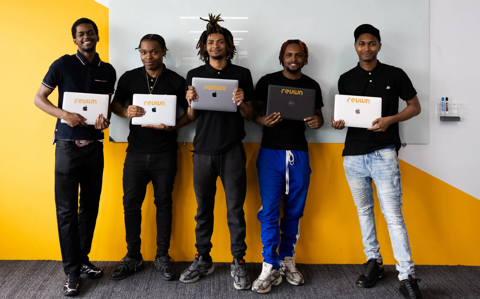 Emergent Works participants holding their laptops